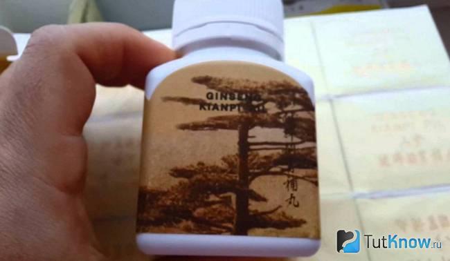 Баночка с Ginseng Kianpi Pil в руке