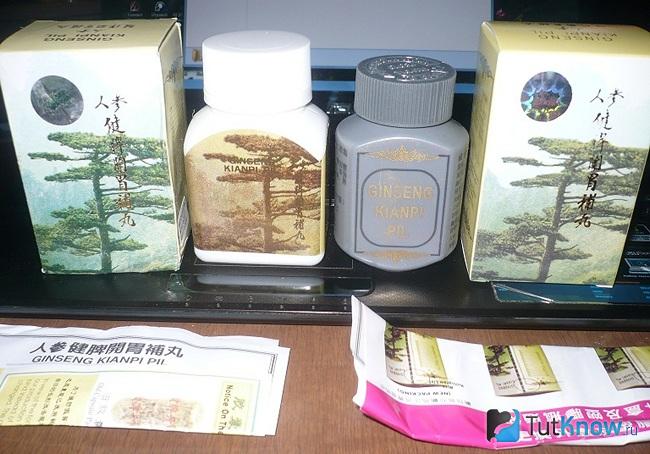 Две баночки с Ginseng Kianpi Pil и упаковки от них